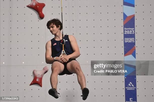 Samuel Watson gestures after winning the gold medal during the men's speed final climbing event during the Pan American Games Santiago 2023, at the...