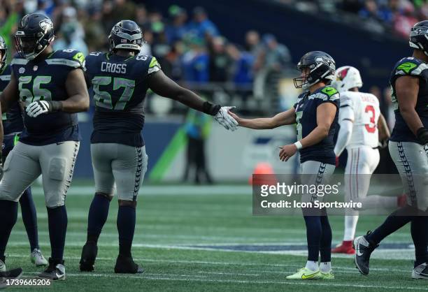 Seattle Seahawks offensive tackle Charles Cross congratulates Seattle Seahawks place kicker Jason Myers on his 2nd half field goal during an NFL game...