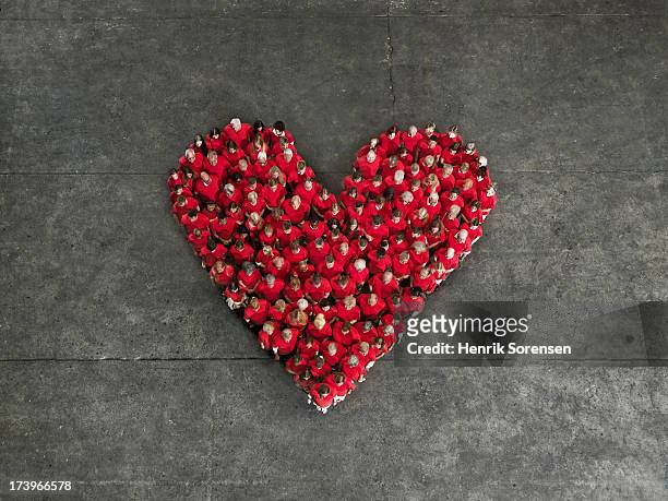 human crowd, forming a heart - people unity stock pictures, royalty-free photos & images