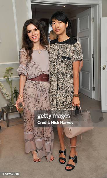 Lara Bohinc and Mimi Xu attend MATCHESFASHION.COM Partners With Rika On 'Iron Girl' Project For Rika Magazine on July 18, 2013 in London, England.