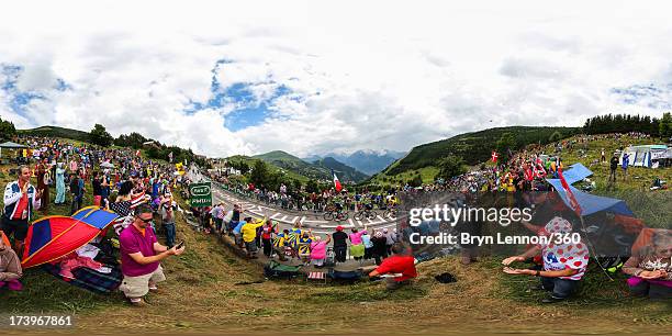 Chris Froome of Great Britain rides amongst the peloton on a climb during stage eighteen of the 2013 Tour de France, a 172.5KM road stage from Gap to...