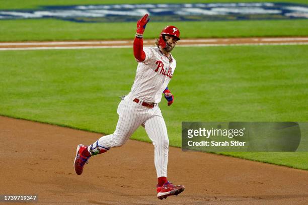 Bryce Harper of the Philadelphia Phillies rounds the bases after hitting a solo home run in the first inning against the Arizona Diamondbacks during...