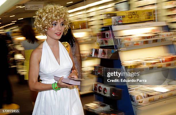 Women dressed as Marilyn Monroe walk during the presentation of the series 'Smash' at FNAC store on July 18, 2013 in Madrid, Spain.