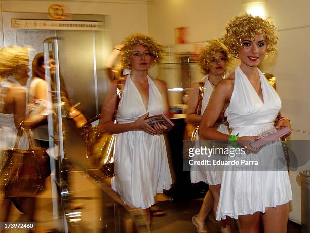 Women dressed as Marilyn Monroe walk during the presentation of the series 'Smash' at FNAC store on July 18, 2013 in Madrid, Spain.