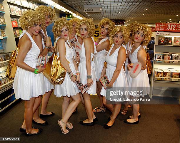 Women dressed as Marilyn Monroe walk during the presentation of the series 'Smash' at FNAC store on July 18, 2013 in Madrid, Spain.