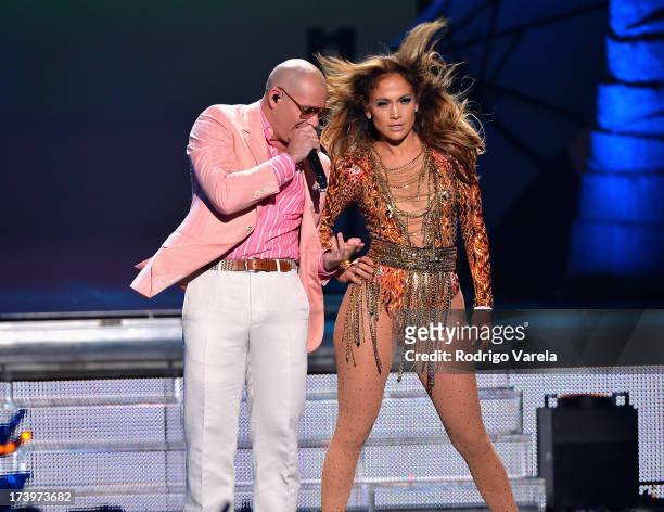 Pitbull and Jennifer Lopez perform onstage during the Premios Juventud 2013 at Bank United Center on July 18, 2013 in Miami, Florida.