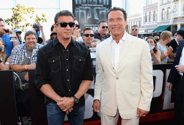 Actor Sylvester Stallone and actor and former California Gov. Arnold Schwarzenegger arrive at the "Escape Plan" premiere during Comic-Con...