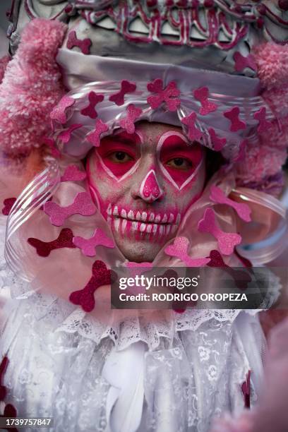Man dressed as a Catrin takes part in the Procession of Catrinas at the Reforma avenue in Mexico City, on October 22, 2023.