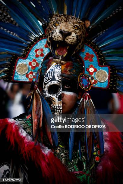 Man dressed as a Catrin takes part in the Procession of Catrinas at the Reforma avenue in Mexico City, on October 22, 2023.