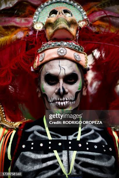 Man dressed as a Catrin takes part in the Procession of Catrinas at the Reforma avenue in Mexico City, on October 22, 2023.