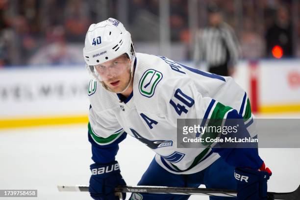 Elias Petterson of the Vancouver Canucks skates against the Edmonton Oilers during the second period at Rogers Place on October 14, 2023 in Edmonton,...