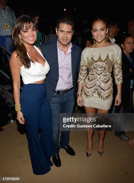 Pamela Silva Conde, Cesar Conde and Jennifer Lopez pose backstage during the Premios Juventud 2013 at Bank United Center on July 18, 2013 in Miami,...