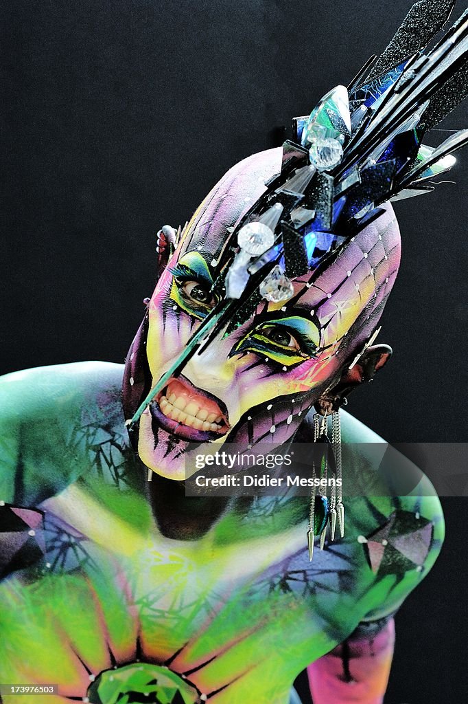 A participant poses with her body paintings designed by bodypainting ...