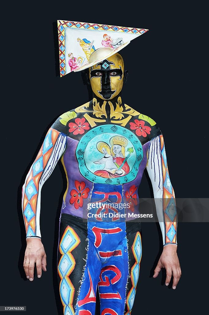 A participant poses with her body paintings designed by bodypainting ...