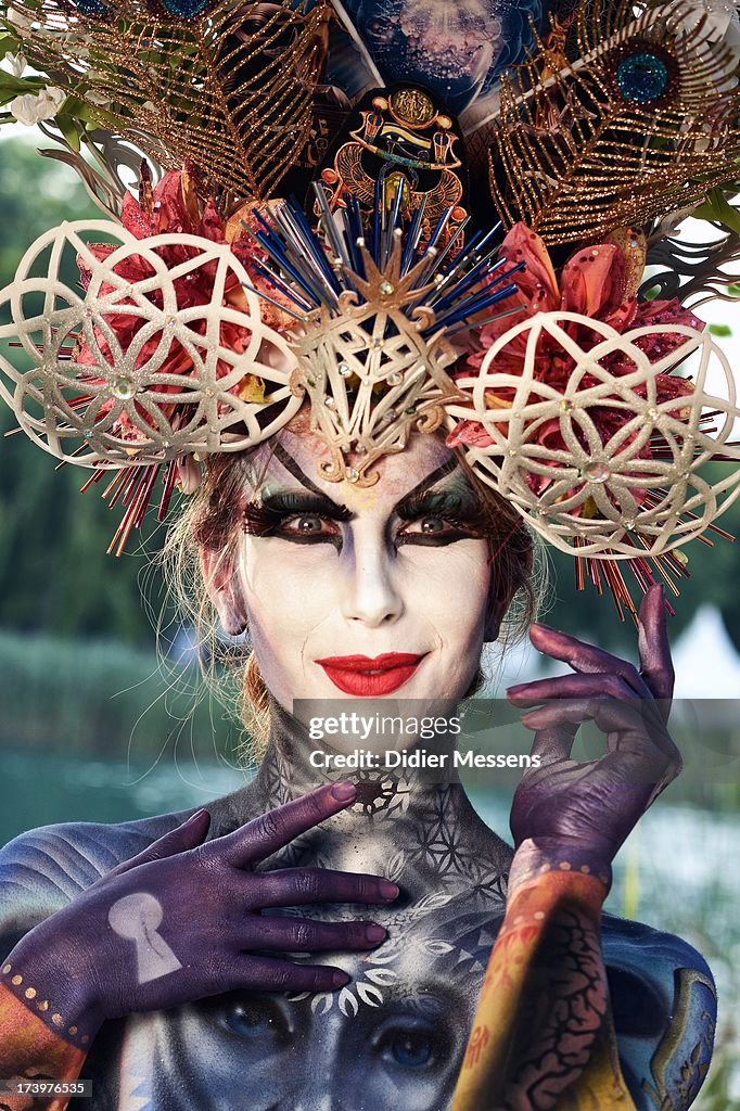 A participant poses with her body paintings designed by bodypainting ...