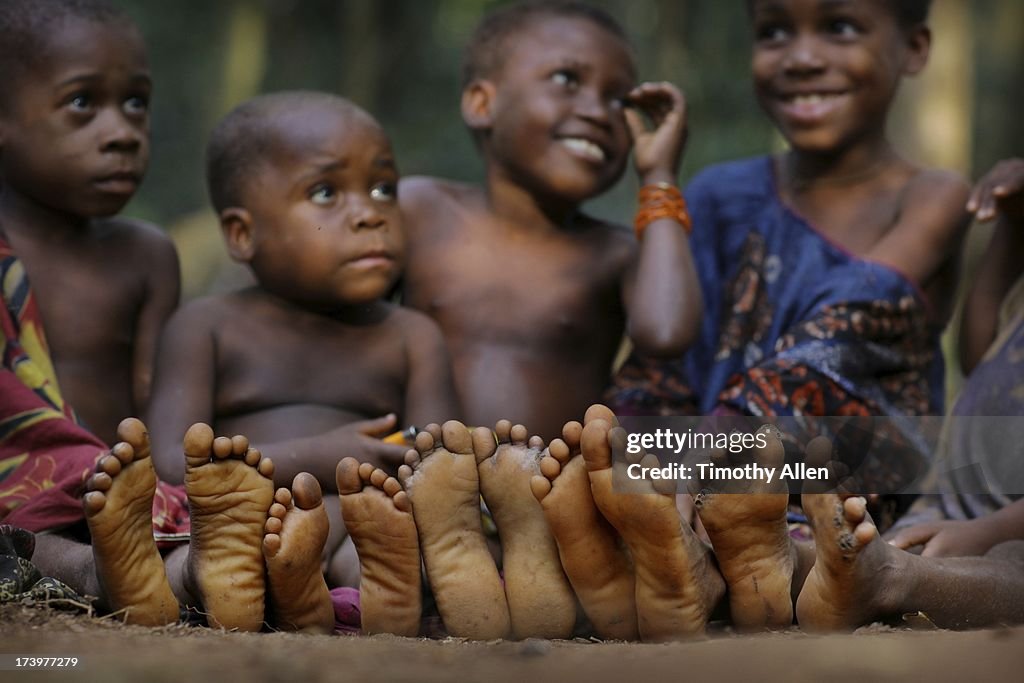 The soles of childrens' feet in a line