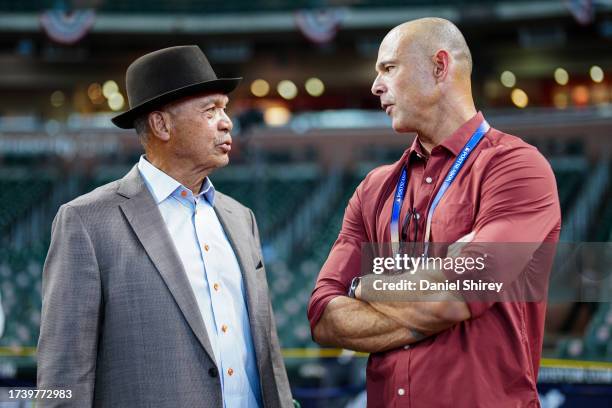 Hall of Famer Reggie Jackson and former player Javier Vazquez talk on the field prior to Game 6 of the ALCS between the Texas Rangers and the Houston...