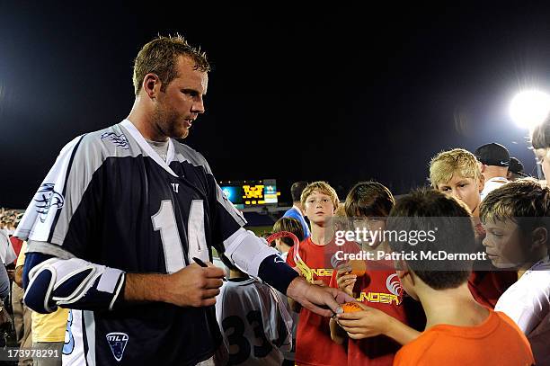 Drew Westervelt of Chesapeake Bayhawks signs autographs for fans after the Bayhawks defeated the Boston Cannons during a game at Navy-Marine Corps...