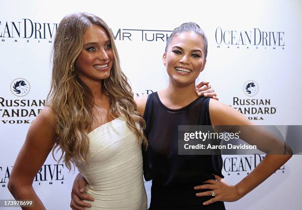 Models Hannah Davis and Chrissy Teigen attend the Ocean Drive Magazine Issue Release Party hosted by cover model Hannah Davis during Mercedes-Benz...