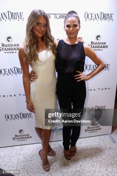 Models Hannah Davis and Chrissy Teigen attend the Ocean Drive Magazine Issue Release Party hosted by cover model Hannah Davis during Mercedes-Benz...