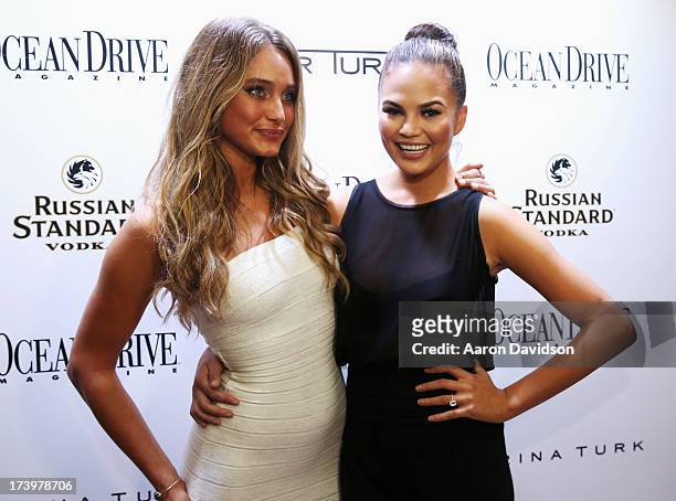 Models Hannah Davis and Chrissy Teigen attend the Ocean Drive Magazine Issue Release Party hosted by cover model Hannah Davis during Mercedes-Benz...