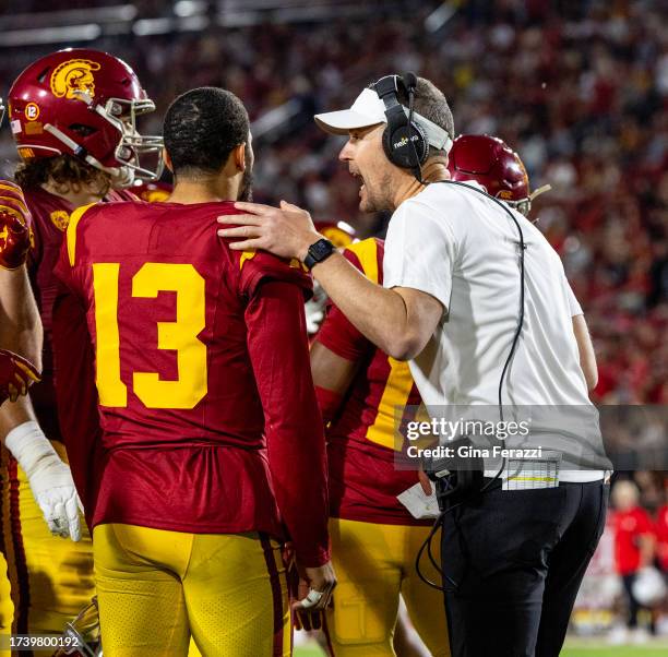 Trojans head coach Lincoln Riley talks with quarterback Caleb Williams during a timeout in the 34-32 loss to Utah at LA Memorial Coliseum on October...