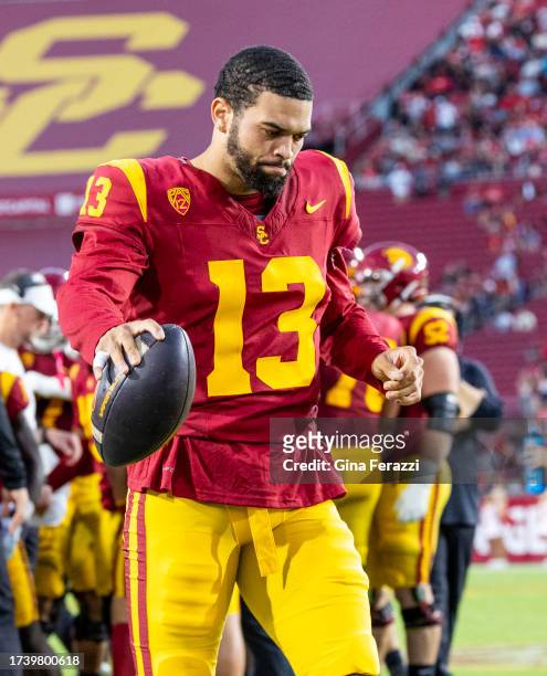 Trojans quarterback Caleb Williams stays loose during a timeout in the 34-32 loss to Utah at LA Memorial Coliseum on October 21, 2023 in Los Angeles,...