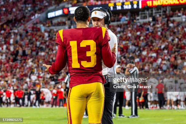 Trojans head coach Lincoln Riley talks with quarterback Caleb Williams during a timeout in the 34-32 loss to Utah at LA Memorial Coliseum on October...