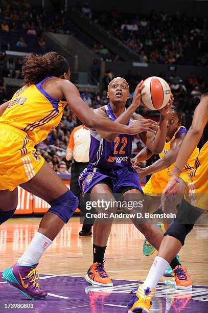 Charde Houston of the Phoenix Mercury holds the basketball while being guarded by Nneka Ogwumike of the Los Angeles Sparks at Staples Center on July...