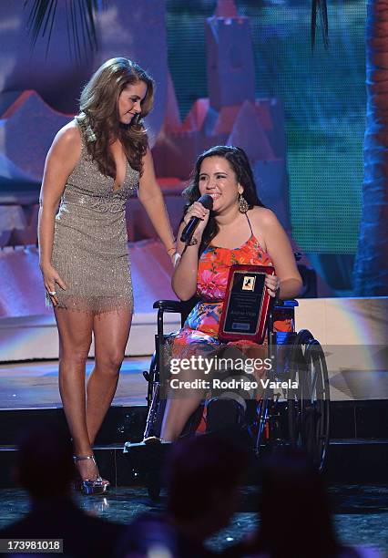 Singer Lucero presents an award onstage during the Premios Juventud 2013 at Bank United Center on July 18, 2013 in Miami, Florida.