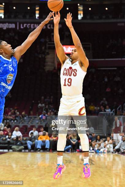 Julien Ducree of Maccabi Ra'anana tries to block Zhaire Smith of the Cleveland Cavaliers d2h of a preseason exhibition game at Rocket Mortgage...