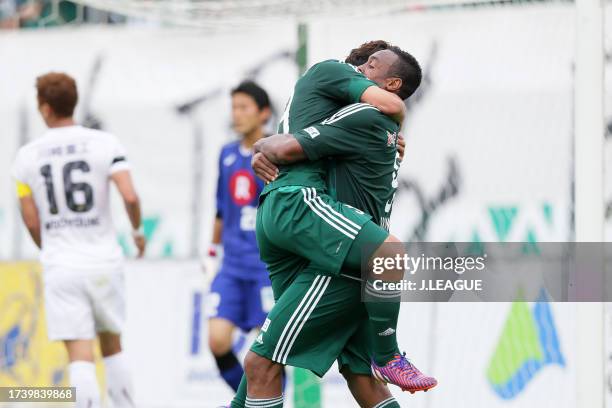 Yoshiro Abe of Matsumoto Yamaga celebrates with teammate Obina after scoring his team's second goal during the J.League J1 first stage match between...