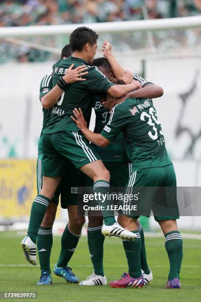 Yoshiro Abe of Matsumoto Yamaga celebrates with teammates after scoring his team's second goal during the J.League J1 first stage match between...