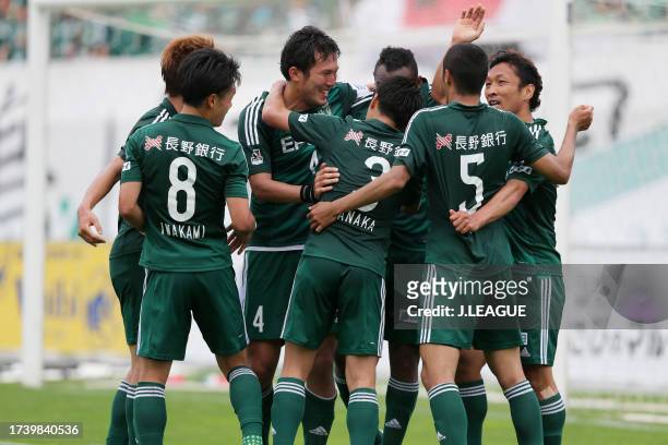 Yoshiro Abe of Matsumoto Yamaga celebrates with teammates after scoring his team's second goal during the J.League J1 first stage match between...