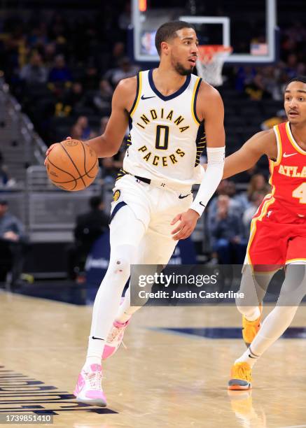 Tyrese Haliburton of the Indiana Pacers brings the ball up the court during the second half in the game against the Atlanta Hawks at Gainbridge...