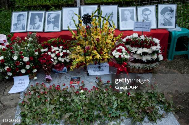 Flowers are placed in front of the Ministry Office where 9 martyrs were killed, during Martyrs' Day in Yangon on July 19, 2013. General Aung San and...