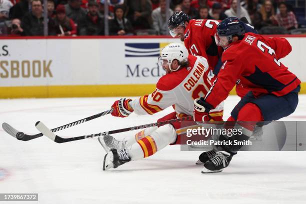 Blake Coleman of the Calgary Flames shoots against the Washington Capitals during the third period at Capital One Arena on October 16, 2023 in...