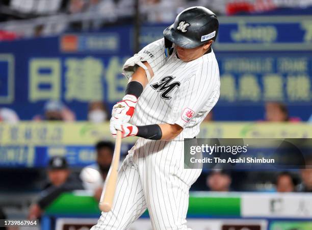 Hisanori Yasuda of the Chiba Lotte Marines hits the game-winning double in the 10th inning against Fukuoka SoftBank Hawks during the Pacific League...