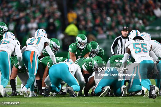 Philadelphia Eagles Quarterback Jalen Hurts readies to run a QB sneak in the first half during the game between the Miami Dolphins and Philadelphia...