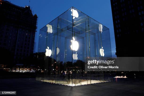 View at daybreak of the illuminated extrance to the Apple 24-hour store , designed by Bohlin Cywinski Jackson, Manhattan, New York, May 28, 2013.