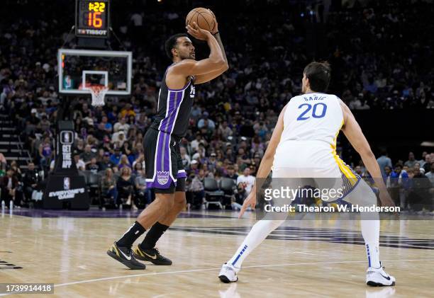 Trey Lyles of the Sacramento Kings shoots over Dario Saric of the Golden State Warriors during the first half of an NBA basketball game at Golden 1...