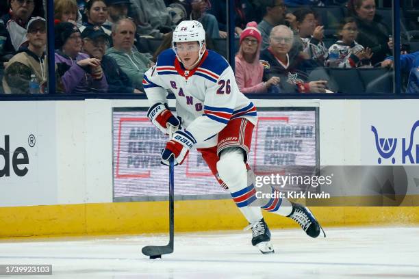 Jimmy Vesey of the New York Rangers controls the puck during the game against the Columbus Blue Jackets at Nationwide Arena on October 14, 2023 in...