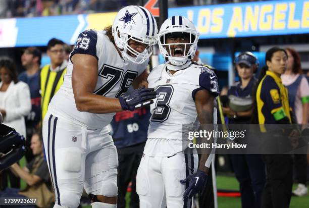 Brandin Cooks of the Dallas Cowboys celebrates a touchdown in the fourth quarter against the Los Angeles Chargers at SoFi Stadium on October 16, 2023...