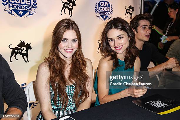 Actresses Holland Roden and Crystal Reed attend MTV2 Party in The Park at Comic-con International 2013 at PETCO Park on July 18, 2013 in San Diego,...