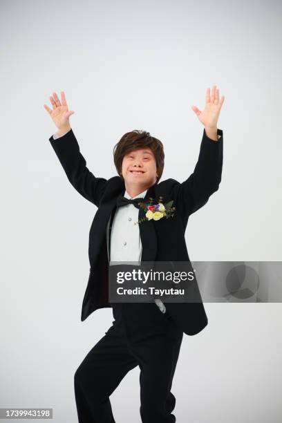 studio portrait of a man in a tuxedo. - corsage stock pictures, royalty-free photos & images