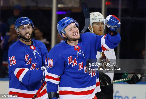 Vincent Trocheck and Artemi Panarin of the New York Rangers celebrate Trocheck's game-winning goal against the Arizona Coyotes at Madison Square...