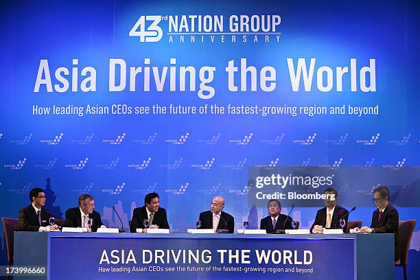 Ngo Thanh Tung, chairman of Vietnam International Law Firm, from left, Paul Blanche-Horgan, chief executive officer of Ezecom Corp., Zaw Zaw,...