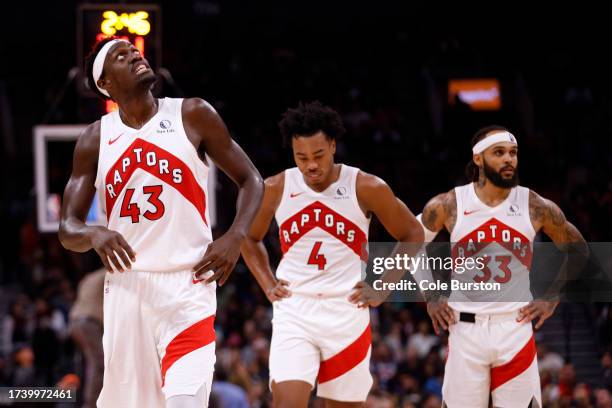 Pascal Siakam, Scottie Barnes, and Gary Trent Jr. #33 of the Toronto Raptors walk up the court during first half of a pre-season NBA game against the...