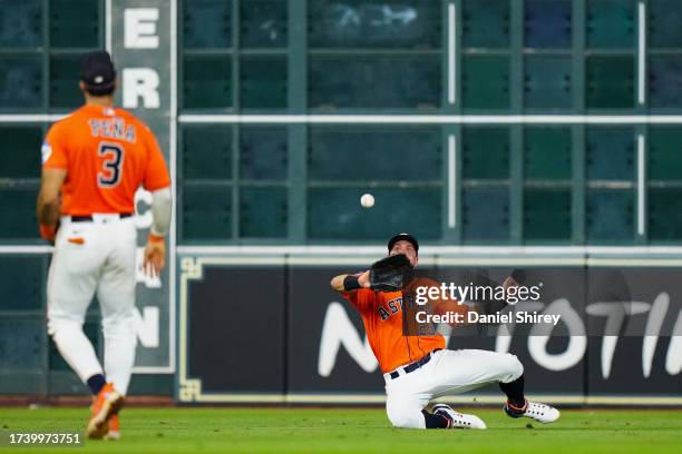 Michael Brantley of the Houston Astros catches a fly ball during Game 6 of the ALCS between the Texas Rangers and the Houston Astros at Minute Maid...