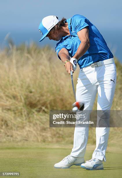 Rickie Fowler of the United States tees off on the 5th hole during the second round of the 142nd Open Championship at Muirfield on July 19, 2013 in...